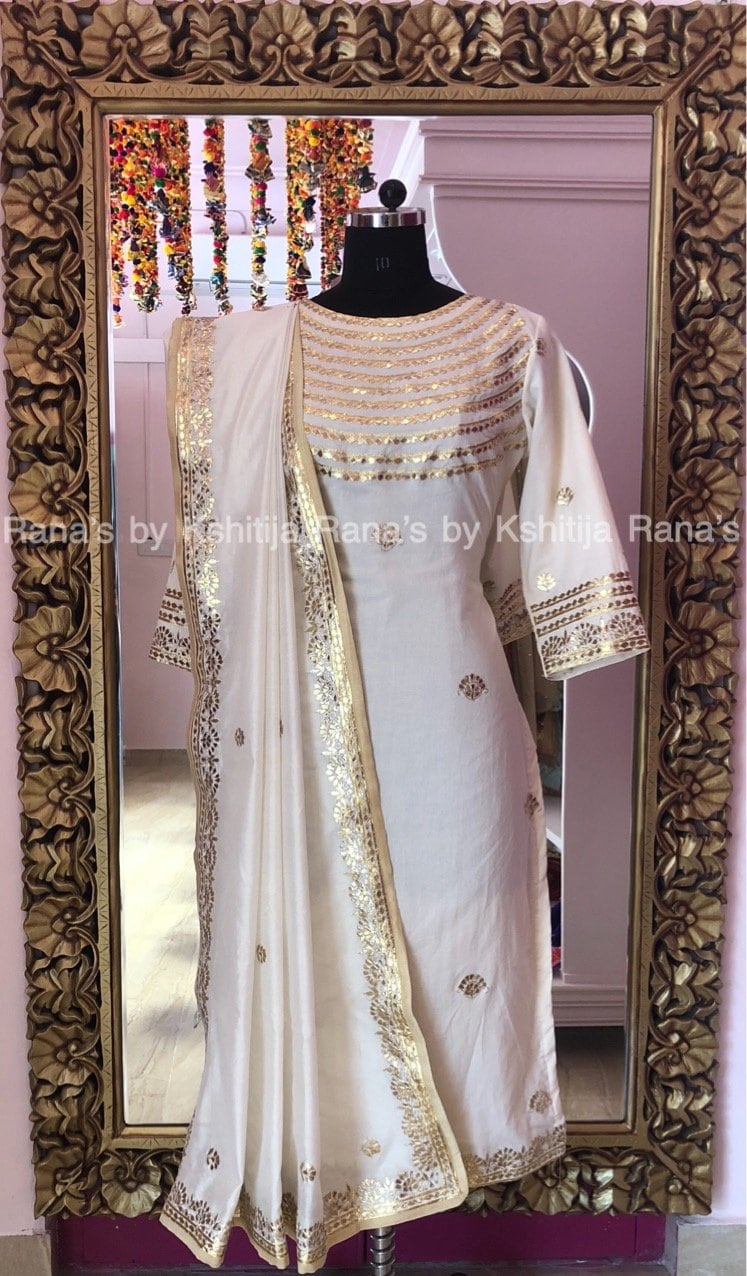 Beautiful white salwar suit with rich neckline work